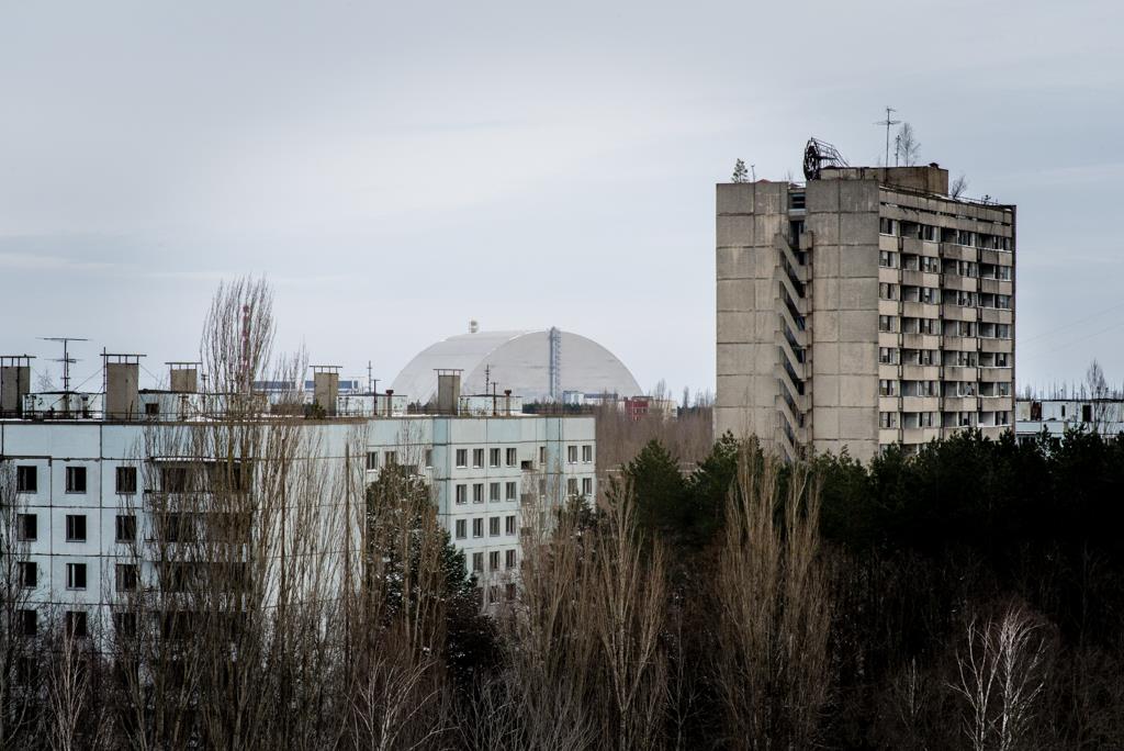 View from the rooftops with the new sarcophagus of Reactor 4 in the not so distant horizon