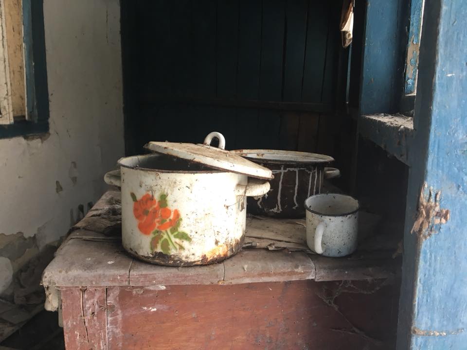 A photo of pots and pans sitting a top of kitchen surface, left behind by the rushing residents as they evacuated their homes. 