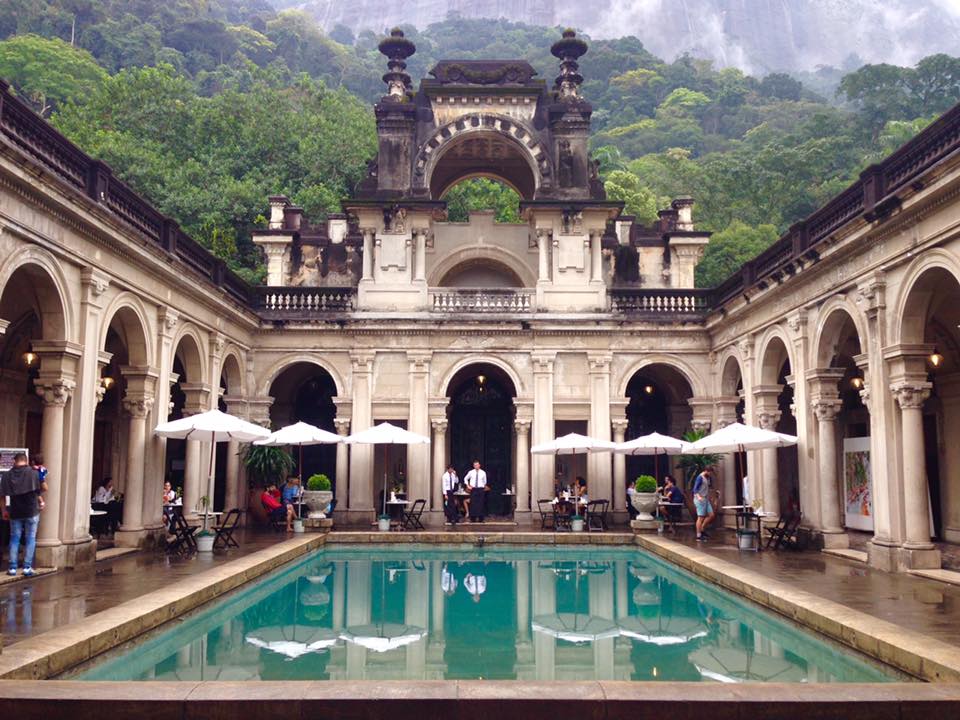 Photo of the mansion atrium and it's bright blue pool