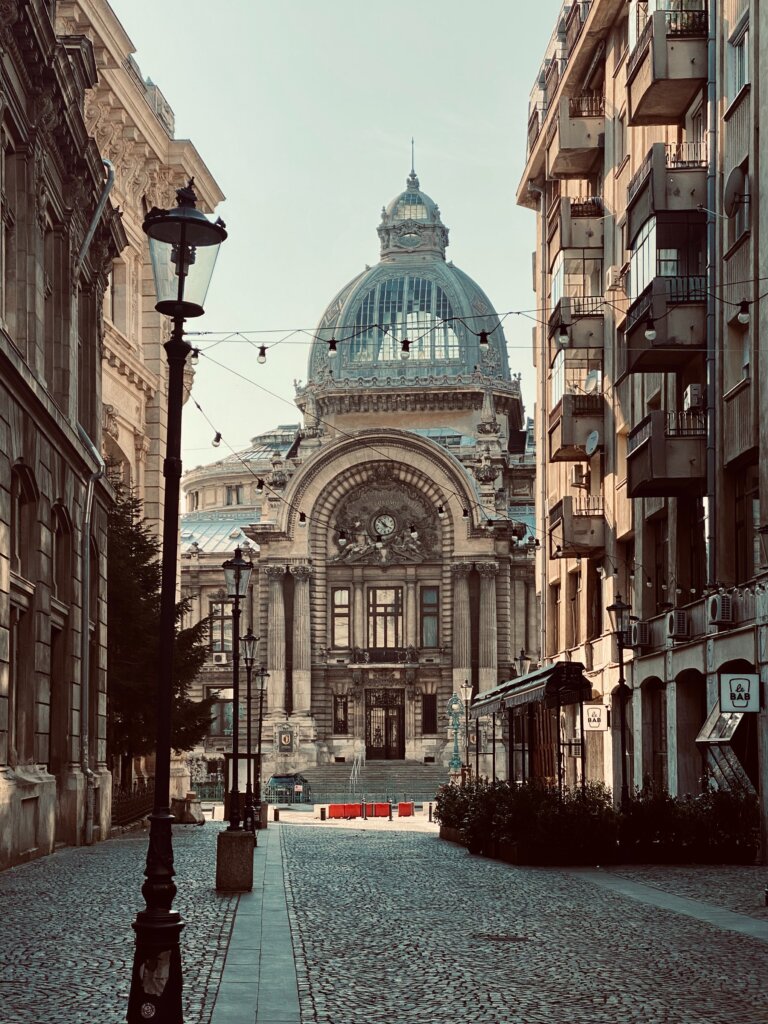 Impressive building with a glass dome in Bucharest, Romania