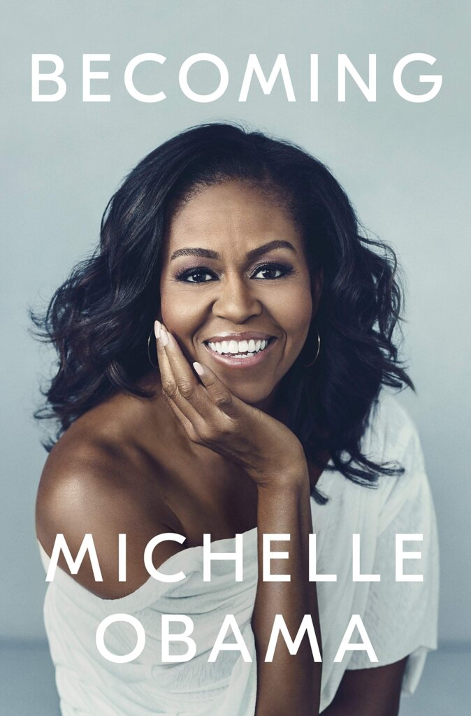 Book Cover for Becoming with a picture of a smiling Michelle Obama. 