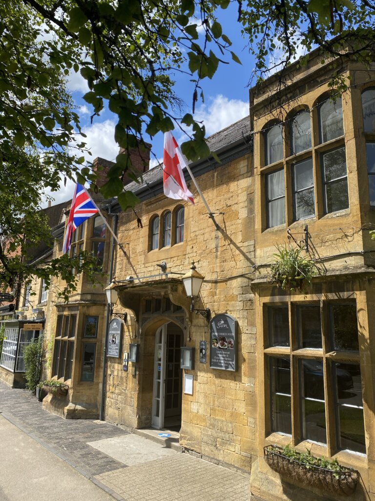 One of the many pubs in Moreton in Marsh. This one here is the Swan Inn with the Great Britain and English flags flying outside