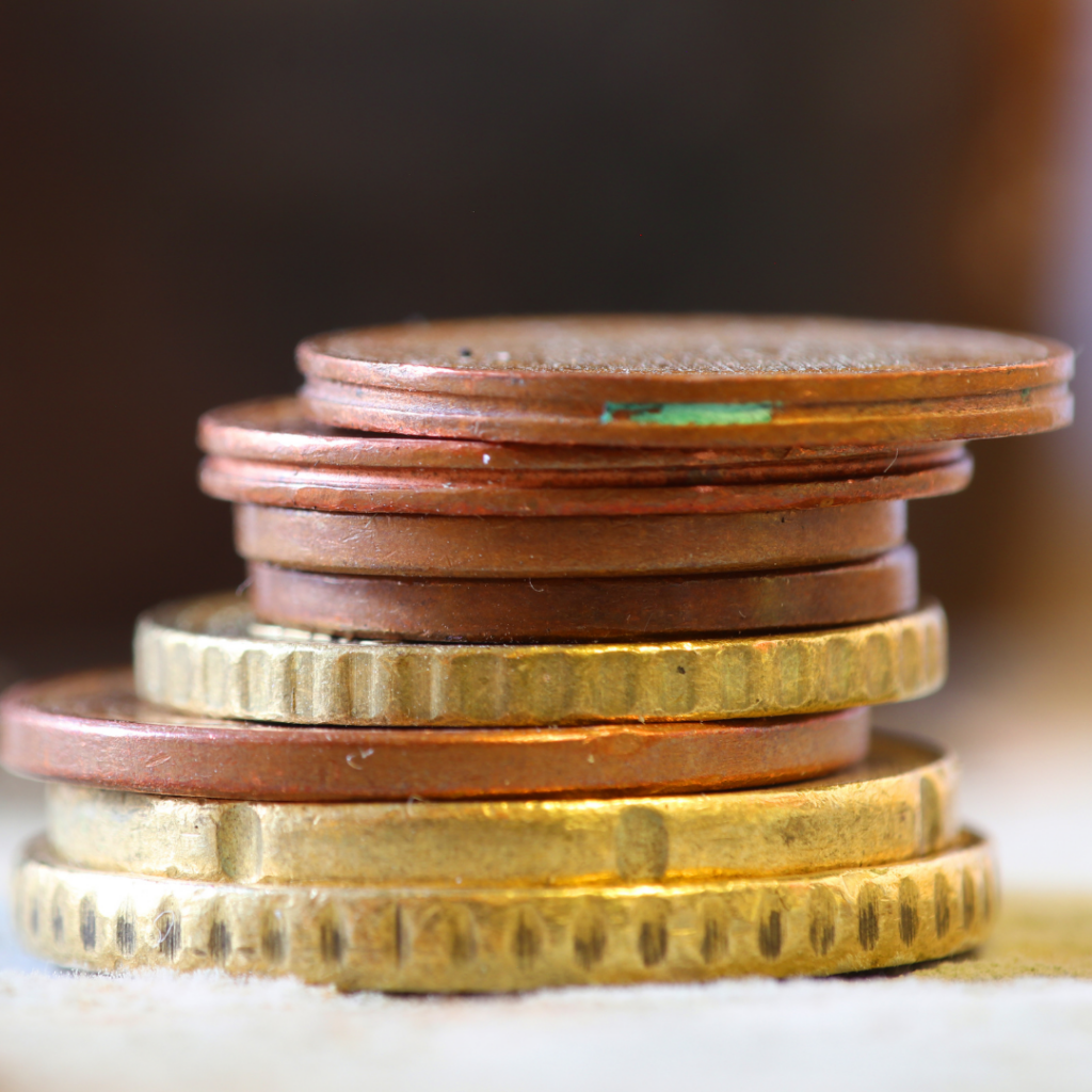 Image of small denomination coins. Tipping in Spain