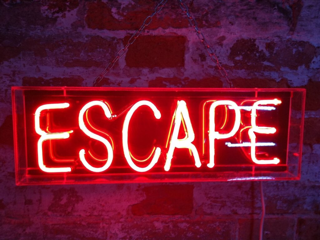 Big neon sign saying "escape"