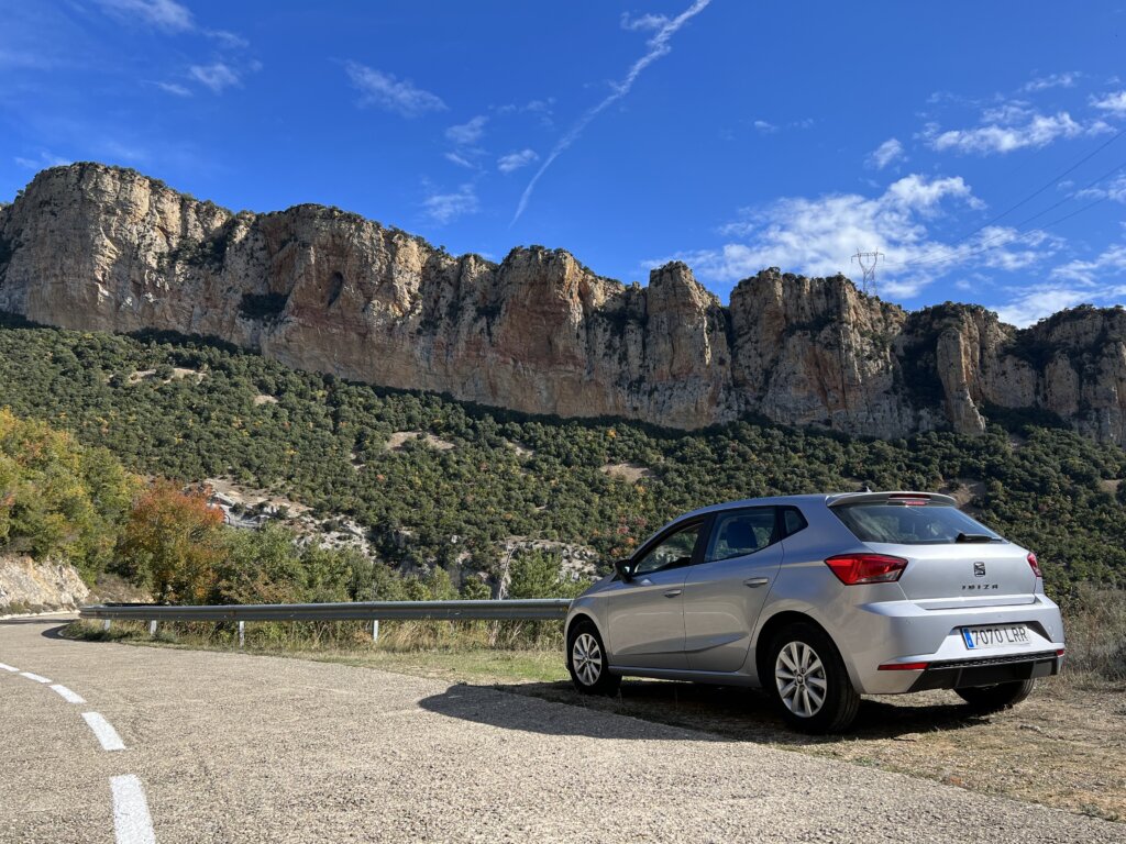 My hire car parked up on the side of the road with an impressive mountain range in front of me. Had I chosen public transport as a way to minimise my carbon footprint I wouldn't have had the chance to see views like these. 