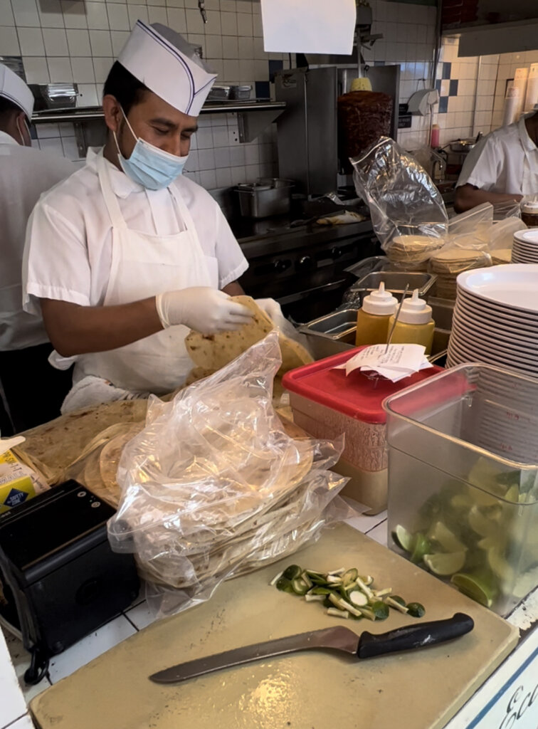 One of the cooks preparing our food