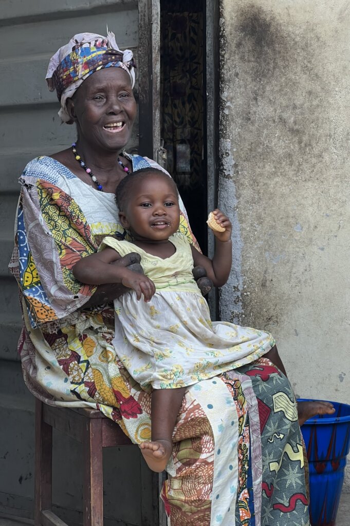 Amputee grandmother holding a cute baby