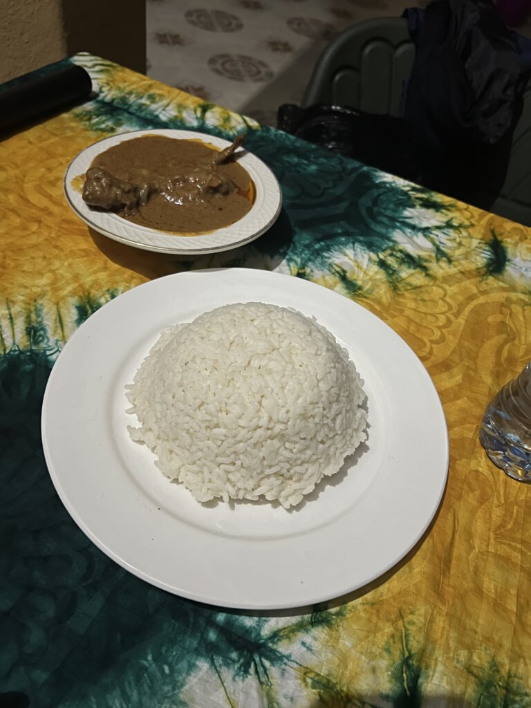 A humangous portion of rice and a thick peanut soup