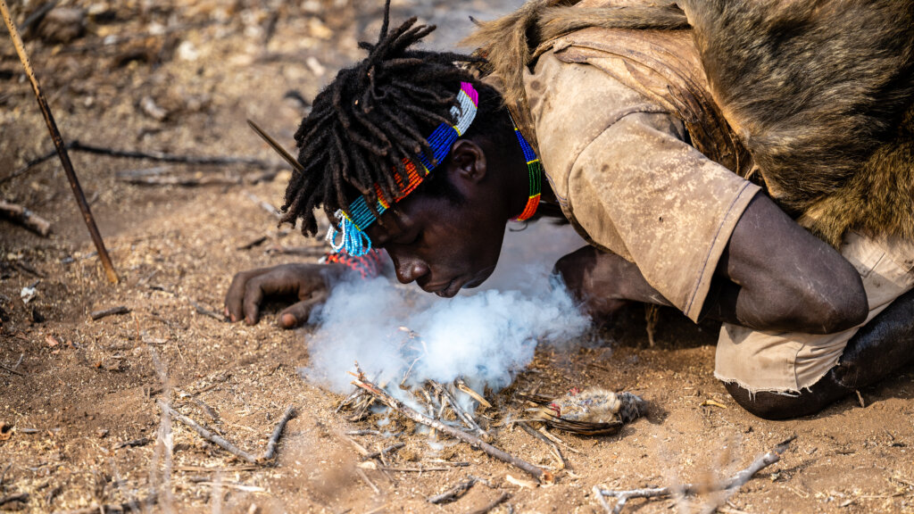 Hadzabe tribe - tribesman lights fire - Tanzania cultural experiences