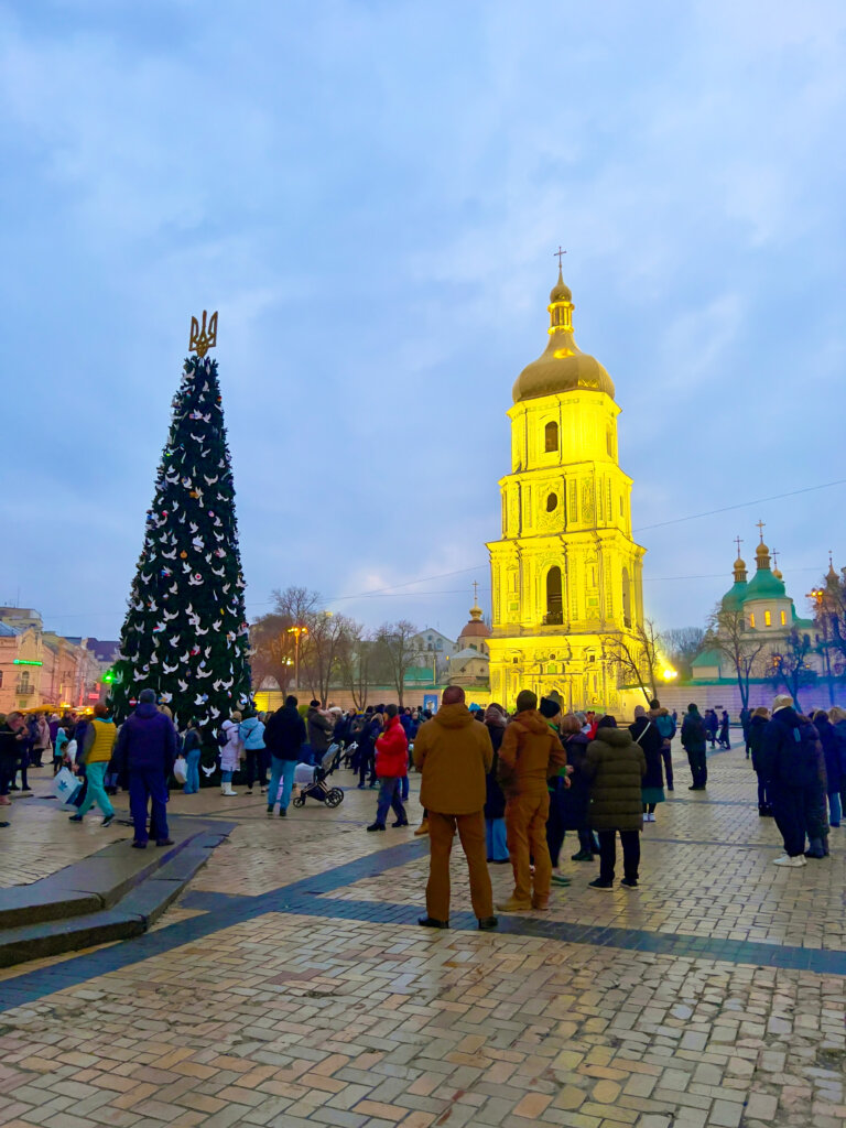 Lots of people are out enjoying the Christmas tree, standing proud despite the war