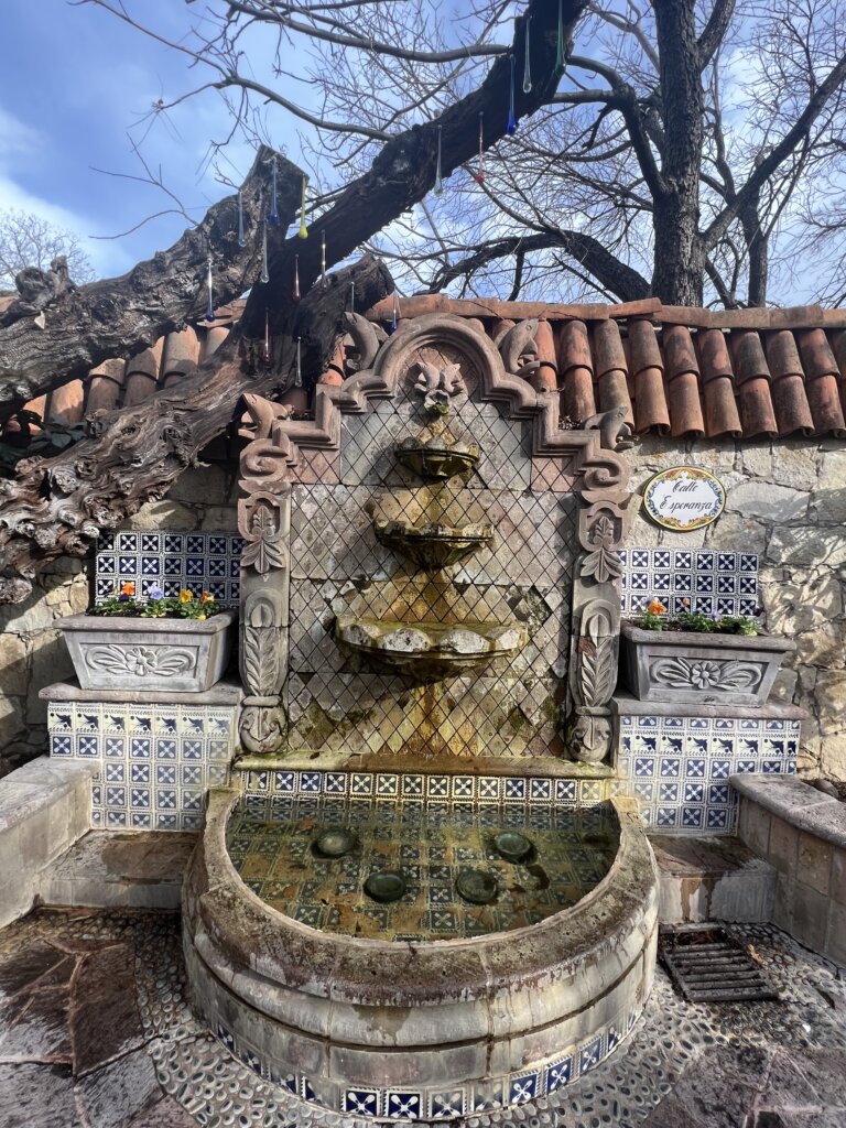 A tiled fountain in need of a clean