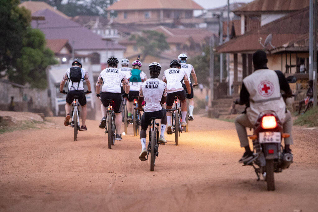 The bike challenge is under way! Street Child t-shirts pedal away into the streets of Makeni