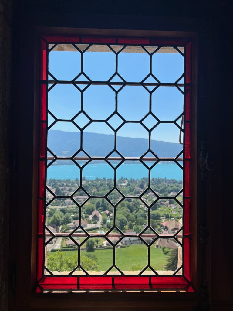 Looking through one of the castles windows out to the lake