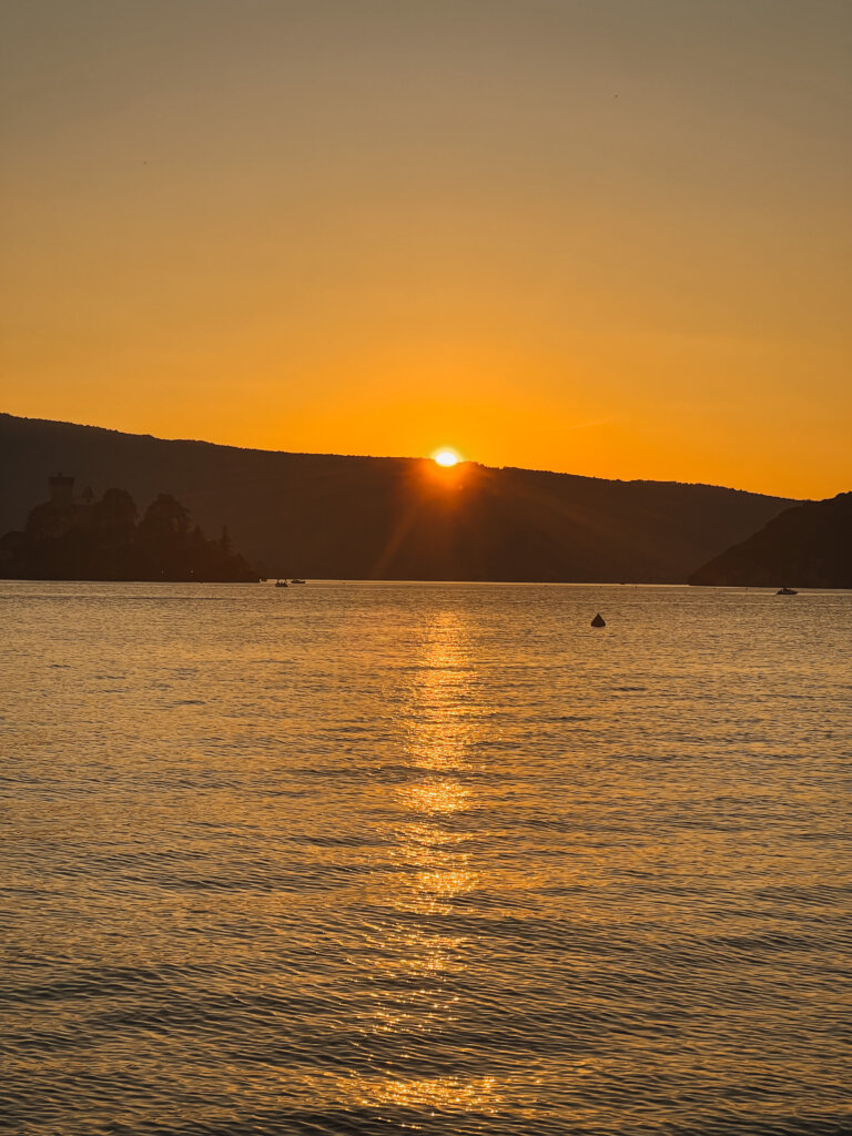 Sun setting across Lake Annecy as seen from Guinguette des Cassines a Angon