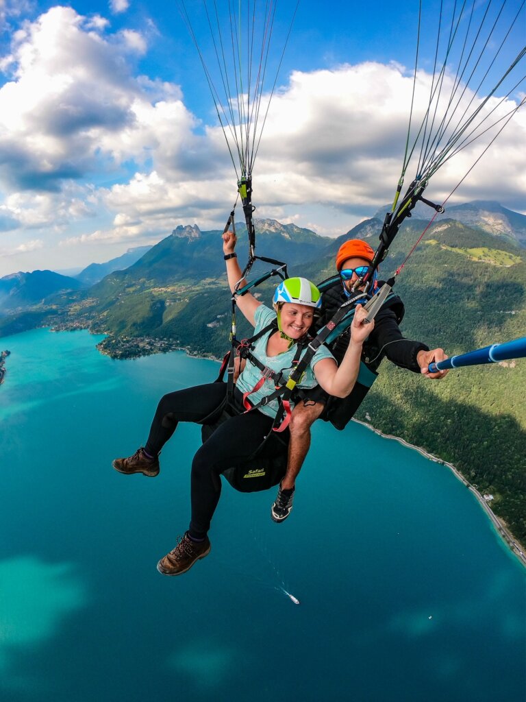 Paragliding over Lake Annecy with Annecy Mountains in the background