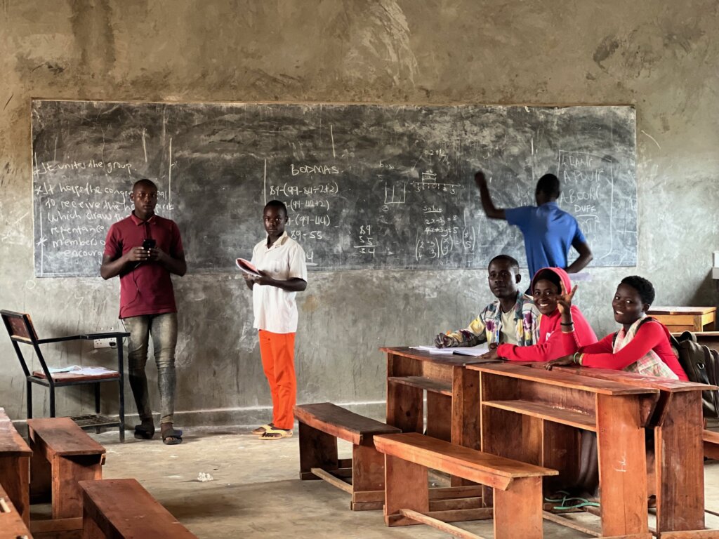 A classroom of young adults at Kyangwali Refugee Settlement 