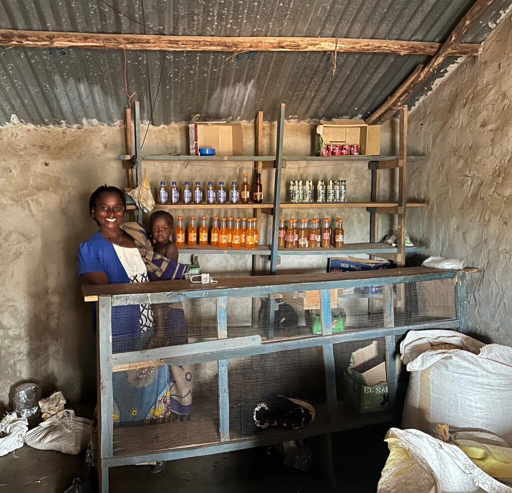 Gloria stands proudly in front of her shop