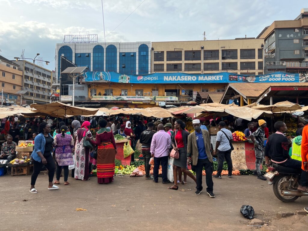 The busy entrance to the Nakasero Food Market. Vendors display their fruit and beg on the floor