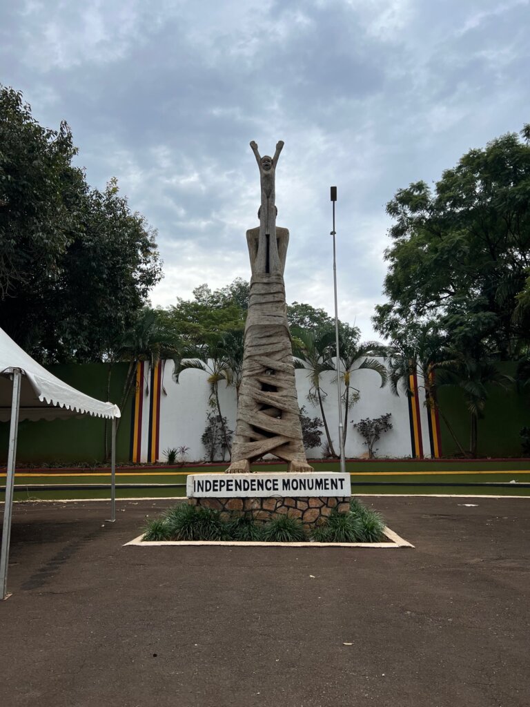 Independence monument in Kampala. A woman bound by ties but with her arms free, lifting up a baby as a sign of independence for the next generation. 