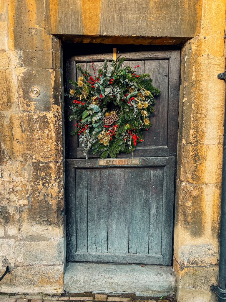 A gorgeous old stable door with a wreath on it in Chipping Campden High Street