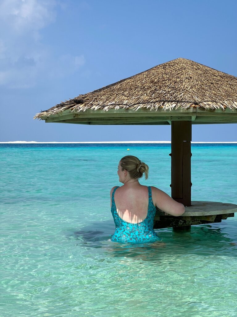 Maldives group tour guest chilling in the water