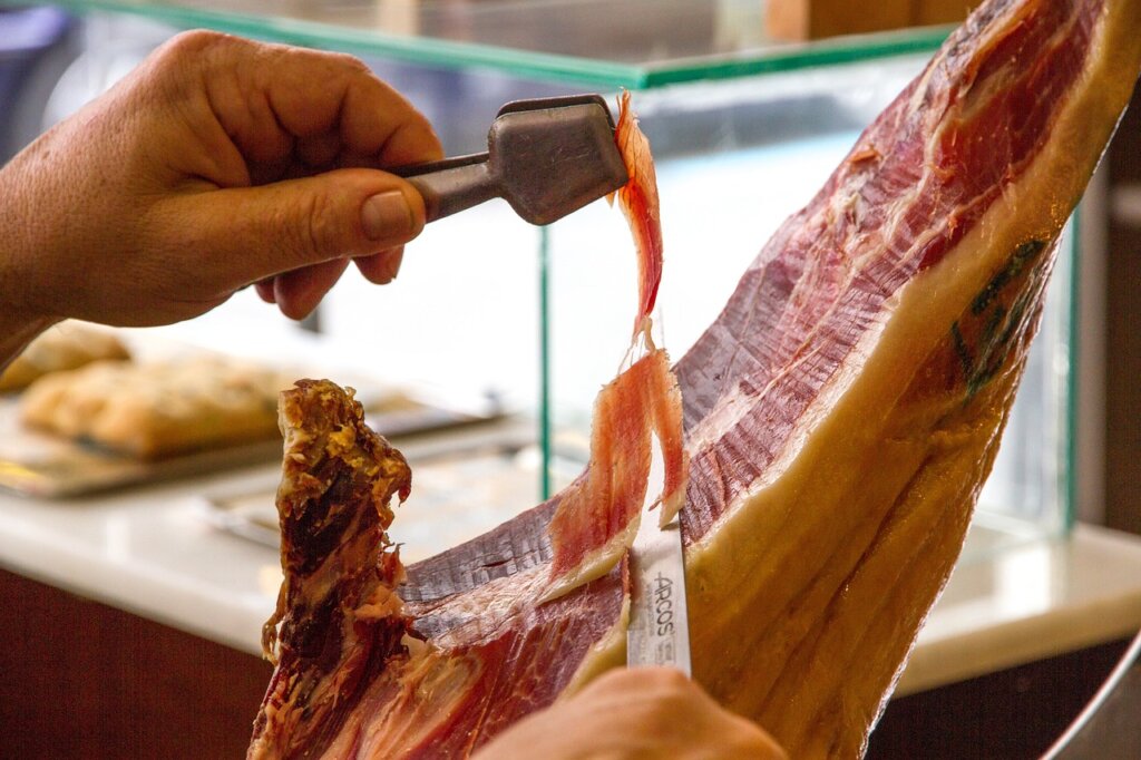 Someone cutting jamon