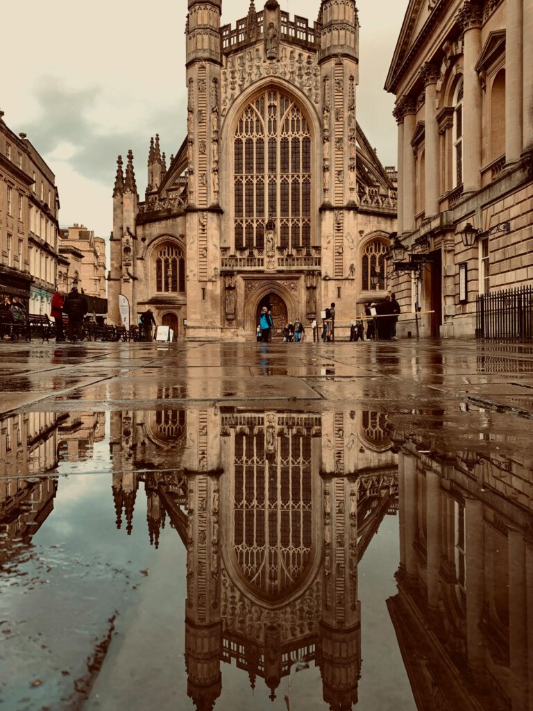 Bath Abbey reflected on a puddle