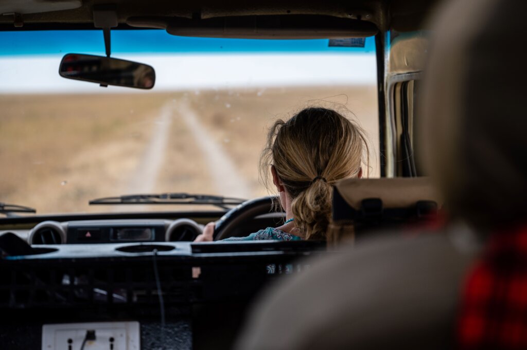 Bea driving in the Serengeti