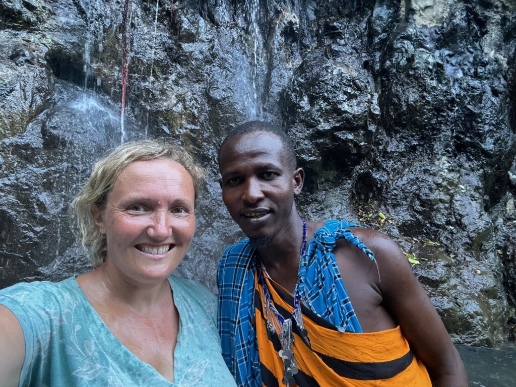 Maasai Warrior at a waterfall