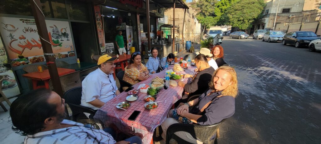 Group enjoying breakfast in Gahsh