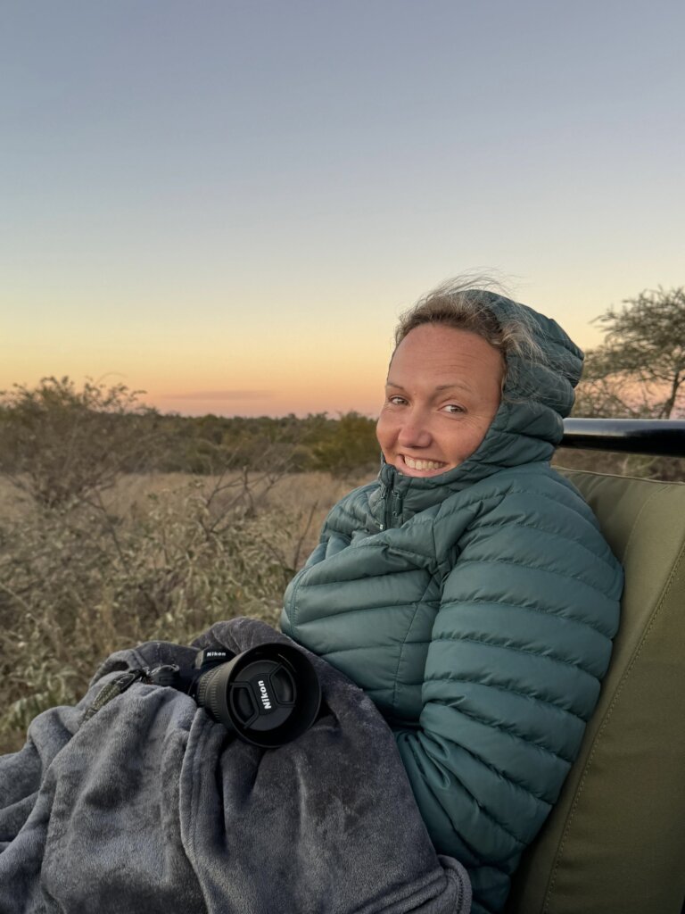 Bea smiling while holding her camera