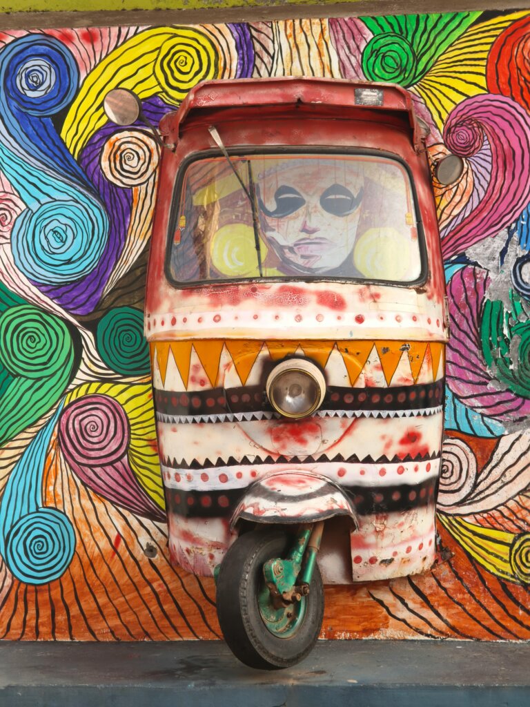 A mural of a tuk tuk