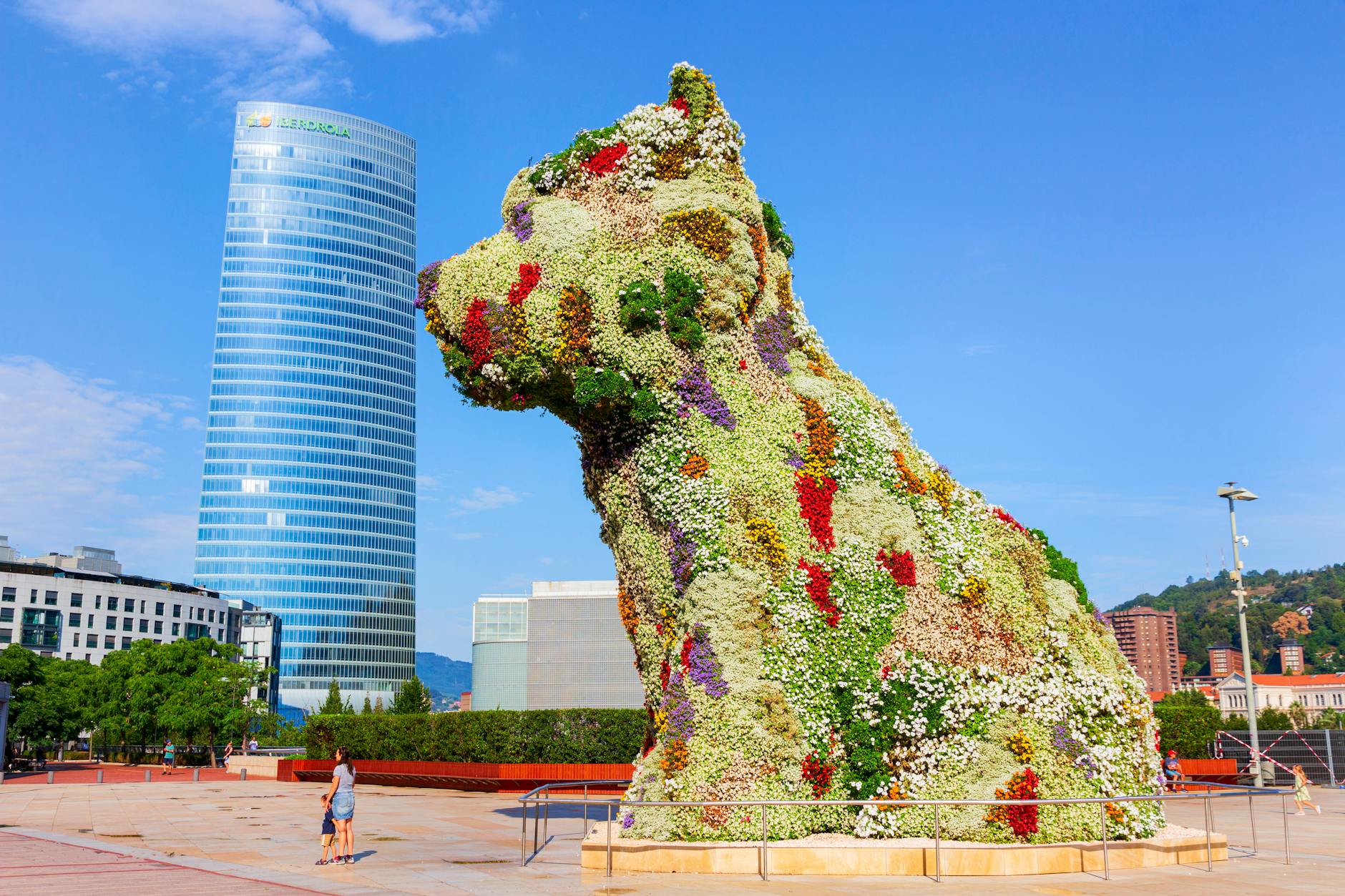 the flower covered puppy statue in bilbao spain